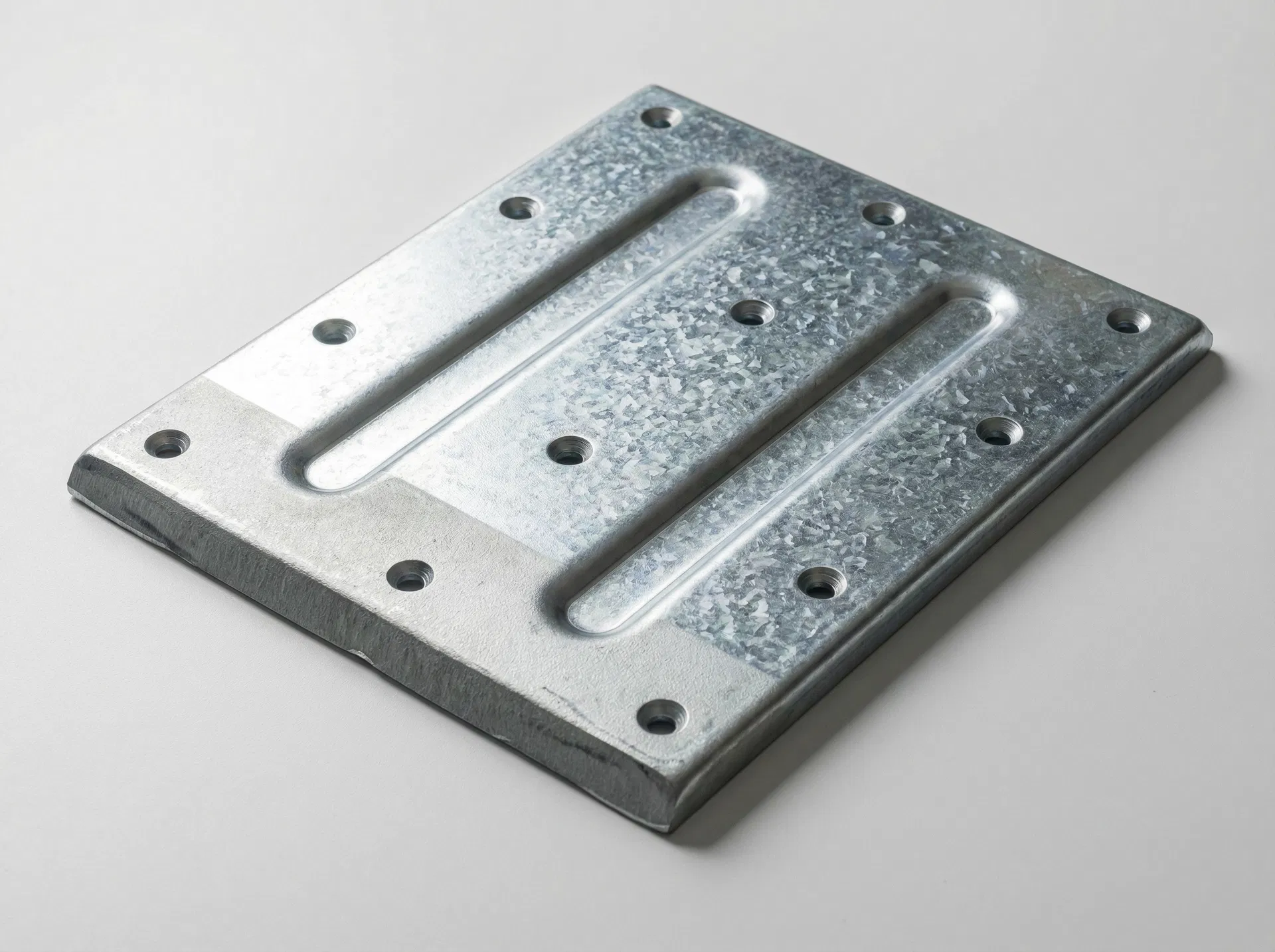 Heavy-Duty Galvanized Mounting Plate: 3.0 mm thick, countersunk holes in precision grid, reinforced structural ribs, zinc-coated for corrosion resistance. Up to 4 mm thickness available.